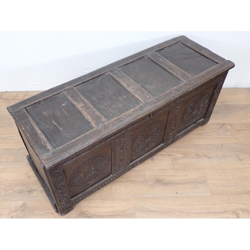 148 - A 17th Century oak Coffer with sunken four panel lid above carved front 3ft 11in W x 1ft 9in H