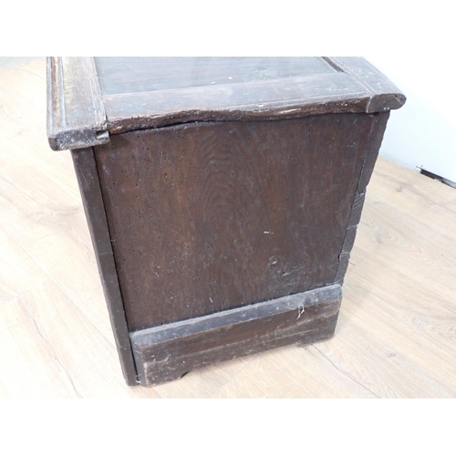 148 - A 17th Century oak Coffer with sunken four panel lid above carved front 3ft 11in W x 1ft 9in H