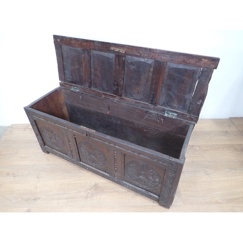 148 - A 17th Century oak Coffer with sunken four panel lid above carved front 3ft 11in W x 1ft 9in H