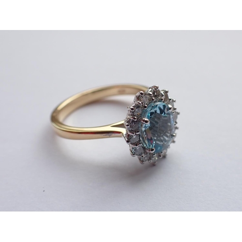 191 - An Aquamarine and Diamond Cluster Ring claw-set oval-cut aquamarine, 0.90cts, within a frame of four... 