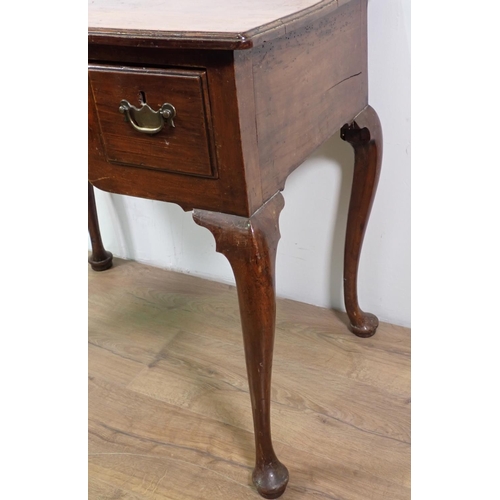 2 - An 18th Century fruitwood Low Boy with moulded top fitted three drawers mounted upon cabriole suppor... 