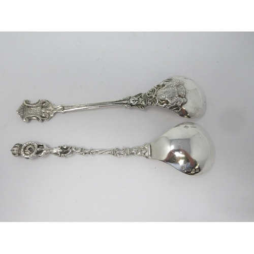 209 - Two Continental silver Spoons with ornate cast handles, import marks London 1903, 220 gms