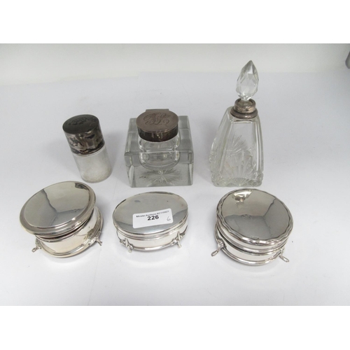 226 - A George V silver lidded square glass Inkwell, London 1912, two silver mounted Scent Bottles and thr... 