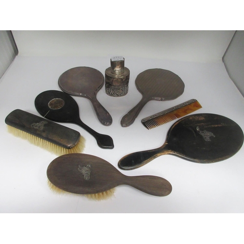 227 - Two silver mounted Hand Mirrors, four other Dressing Table Accessories and an embossed oval silver T... 