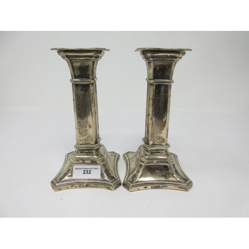 232 - A pair of Victorian silver Candlesticks on shaped square bases, Sheffield 1897, 6 1/2 in