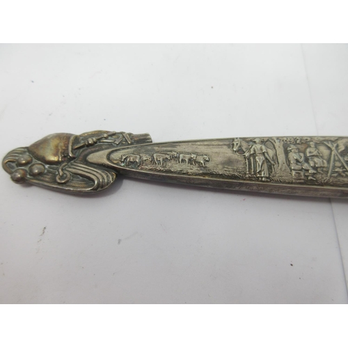 245 - A Mexican style Dagger and Scabbard, the watered steel blade with figures and horses, similar design... 