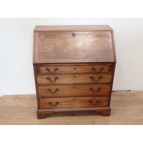 25 - A 19th Century mahogany Bureau the fall front enclosing fitted interior above four graduated drawers... 