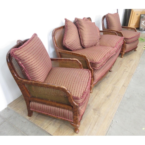 366 - A walnut framed bergere three piece Suite, settee 4ft 6in W x 2ft 9in H, chairs 2ft W (some holes in... 