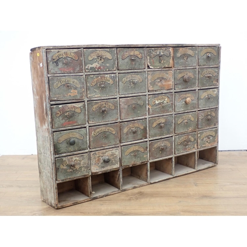 373 - An antique painted pine set of Apothecary Drawers 3ft 9in W x 2ft 7in H