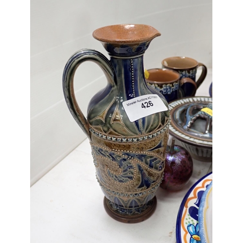 426 - A Doulton Lambeth Ewer restored, two Tankards, a quantity of pottery Chargers, etc.