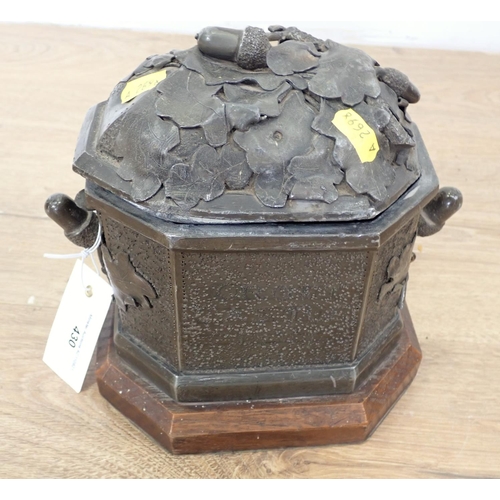 430 - A Victorian lead and oak lidded octagonal Casket with acorn, oak leaf and armorial design 8in W x 8i... 