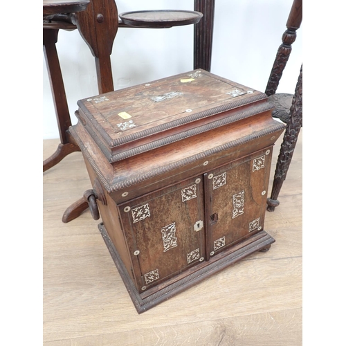 493 - A 19th Century rosewood veneered and mother of pearl inlaid table top Cabinet, the pair of cupboard ... 