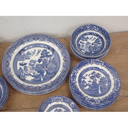 501 - A quantity of willow pattern China, a pair of squat blue glass Candlesticks, glass Knife Rests etc a... 