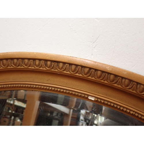 505 - A gilt oval Wall Mirror, another oval Mirror and an oak framed rectangular Wall Mirror