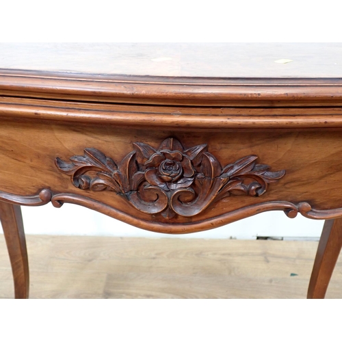 507 - A walnut fold-over Card Table, with applied carving to the shaped frieze on cabriole supports, 2ft 9... 