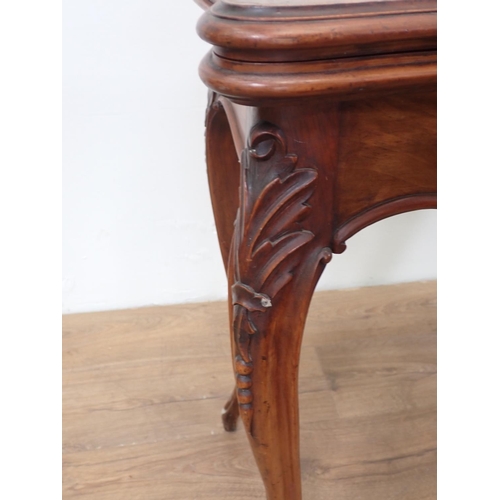 507 - A walnut fold-over Card Table, with applied carving to the shaped frieze on cabriole supports, 2ft 9... 