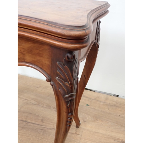 507 - A walnut fold-over Card Table, with applied carving to the shaped frieze on cabriole supports, 2ft 9... 