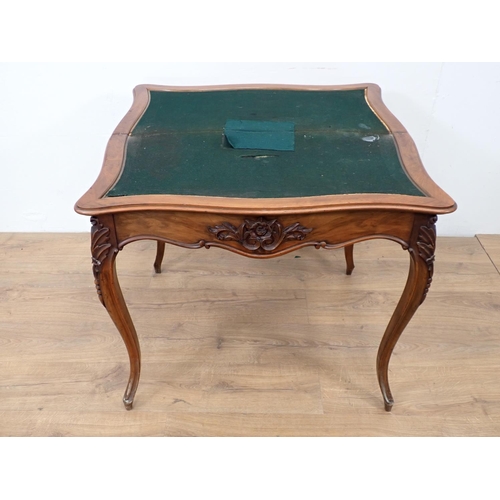 507 - A walnut fold-over Card Table, with applied carving to the shaped frieze on cabriole supports, 2ft 9... 