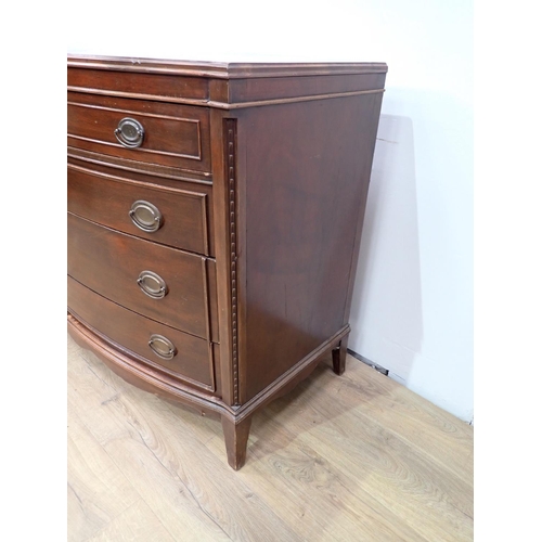 530 - A mahogany bowfront Chest of four long drawers on bracket supports, 4ft W