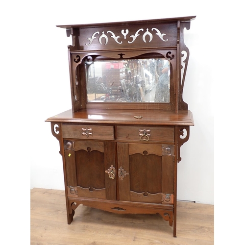 540 - An Art Nouveau walnut mirror back Sideboard fitted two frieze drawers above pair of cupboard doors 5... 