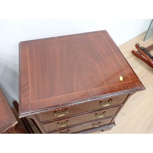 541 - A pair of mahogany veneered Bedside Chests of three drawers on bracket feet 2ft 4in H x 2ft W