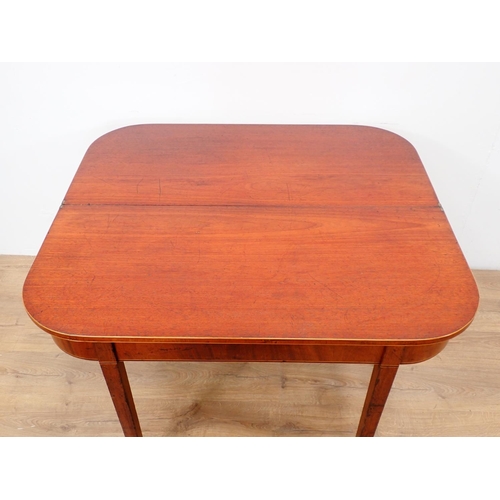 563 - A 19th Century mahogany and inlaid fold over Tea Table on square cut supports 3ft 8in W x 2ft 5in H