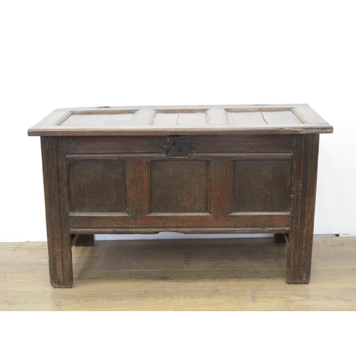 580 - An early 18th Century oak Coffer with sunken three panel lid and front with original pin hinges 4ft ... 