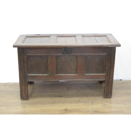 580 - An early 18th Century oak Coffer with sunken three panel lid and front with original pin hinges 4ft ... 