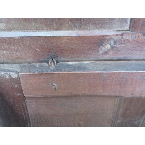 580 - An early 18th Century oak Coffer with sunken three panel lid and front with original pin hinges 4ft ... 