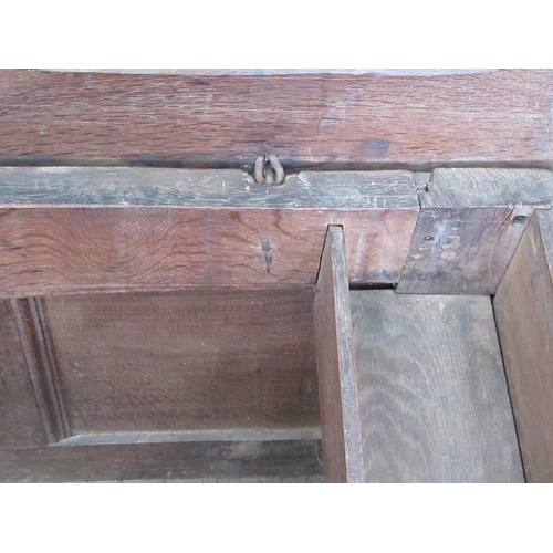 580 - An early 18th Century oak Coffer with sunken three panel lid and front with original pin hinges 4ft ... 