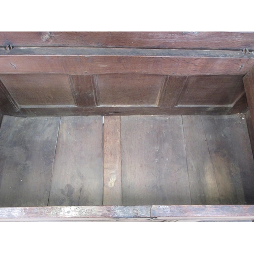 580 - An early 18th Century oak Coffer with sunken three panel lid and front with original pin hinges 4ft ... 