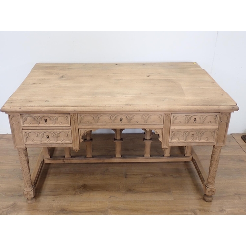 581 - A Gothic influenced oak Desk with arched tracery design fitted three frieze drawers 4ft 5in W x 2ft ... 