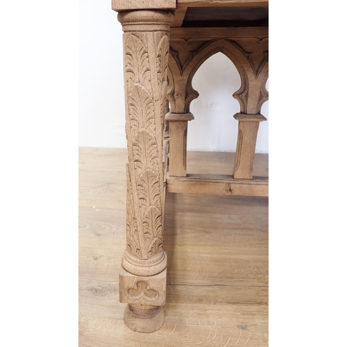 581 - A Gothic influenced oak Desk with arched tracery design fitted three frieze drawers 4ft 5in W x 2ft ... 