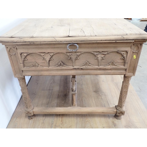 581 - A Gothic influenced oak Desk with arched tracery design fitted three frieze drawers 4ft 5in W x 2ft ... 