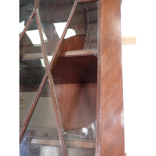 6 - A 19th Century mahogany and astragal glazed Secretaire Bookcase fitted three drawers to base mounted... 