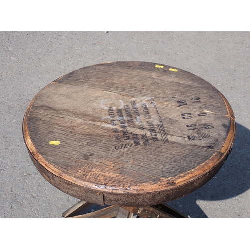 638 - A Garden Table made from a barrel with cross frame, 21in Diam x 27in H