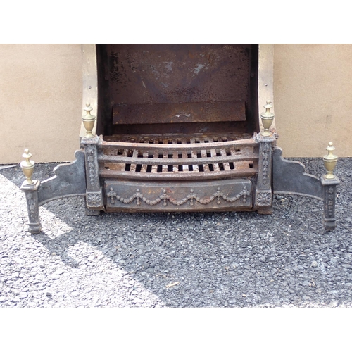 656 - A cast iron and brass mounted Fire Place