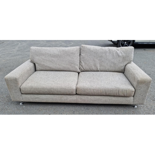 672 - A modern grey upholstered Sofa on metal supports 6ft 6in W x 2ft 10in H