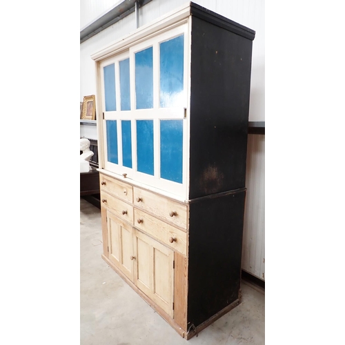 9 - A Victorian pine Housekeeper's Cupboard the upper painted section fitted two sliding doors above bas... 