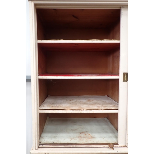 9 - A Victorian pine Housekeeper's Cupboard the upper painted section fitted two sliding doors above bas... 