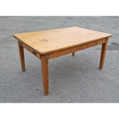 109 - A Victorian pine Farmhouse Table fitted drawer to each end mounted upon square cut tapering supports... 