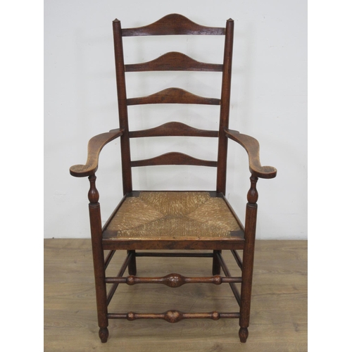 110 - A 19th Century rush seated ladderback Elbow Chair