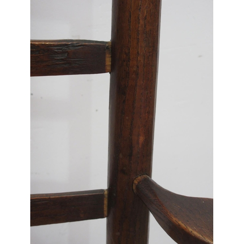 110 - A 19th Century rush seated ladderback Elbow Chair