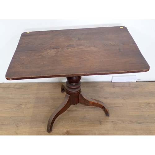 124 - A 19th Century elm rectangular tilt top Supper Table on tripod base 3ft 4in W x 2ft 4in H