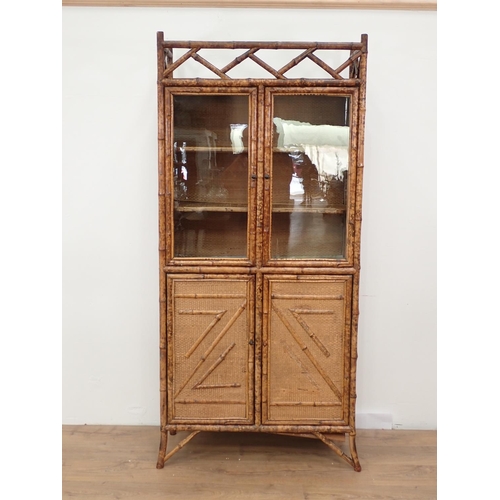 13 - An antique bamboo and glazed Cabinet fitted four cupboard doors 6ft 5in H x 3ft W