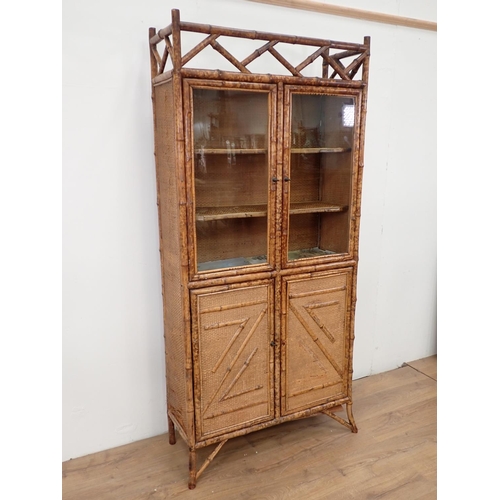 13 - An antique bamboo and glazed Cabinet fitted four cupboard doors 6ft 5in H x 3ft W