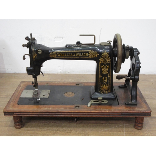 132 - A Wheeler & Wilson Sewing Machine in oak case