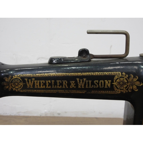 132 - A Wheeler & Wilson Sewing Machine in oak case