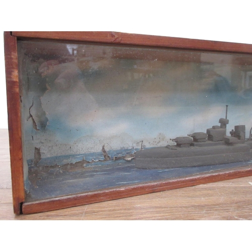 140 - A cased Diorama of a Battleship 19 1/2in W x 5in H