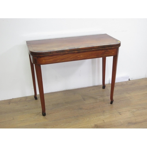 142 - A 19th Century mahogany and inlaid fold-over Tea Table on square cut supports 3ft 1in W x 2ft 5in H